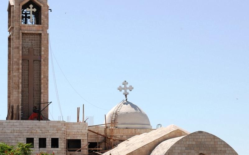 Muslims plant flowers at Behsarah church yard