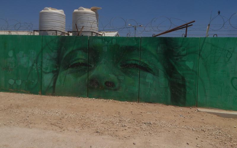 رسم على احد الجدران في مخيم الزعتري / تصوير حزم المازوني