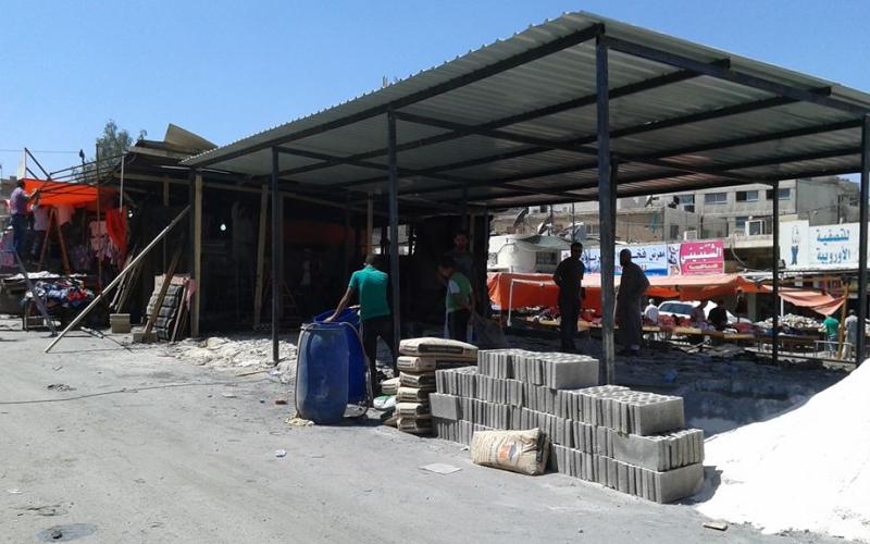 تجار بالة الزرقاء: الحريق "مدبر" لطردنا من السوق