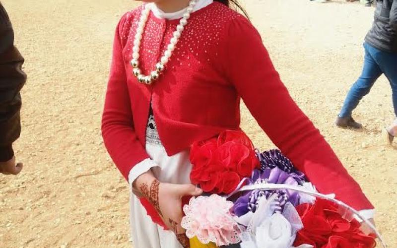 طفلة سورية تحتفل باليوم العالمي للطفل في مخيم الزعتري / تصوير فراس اللباد